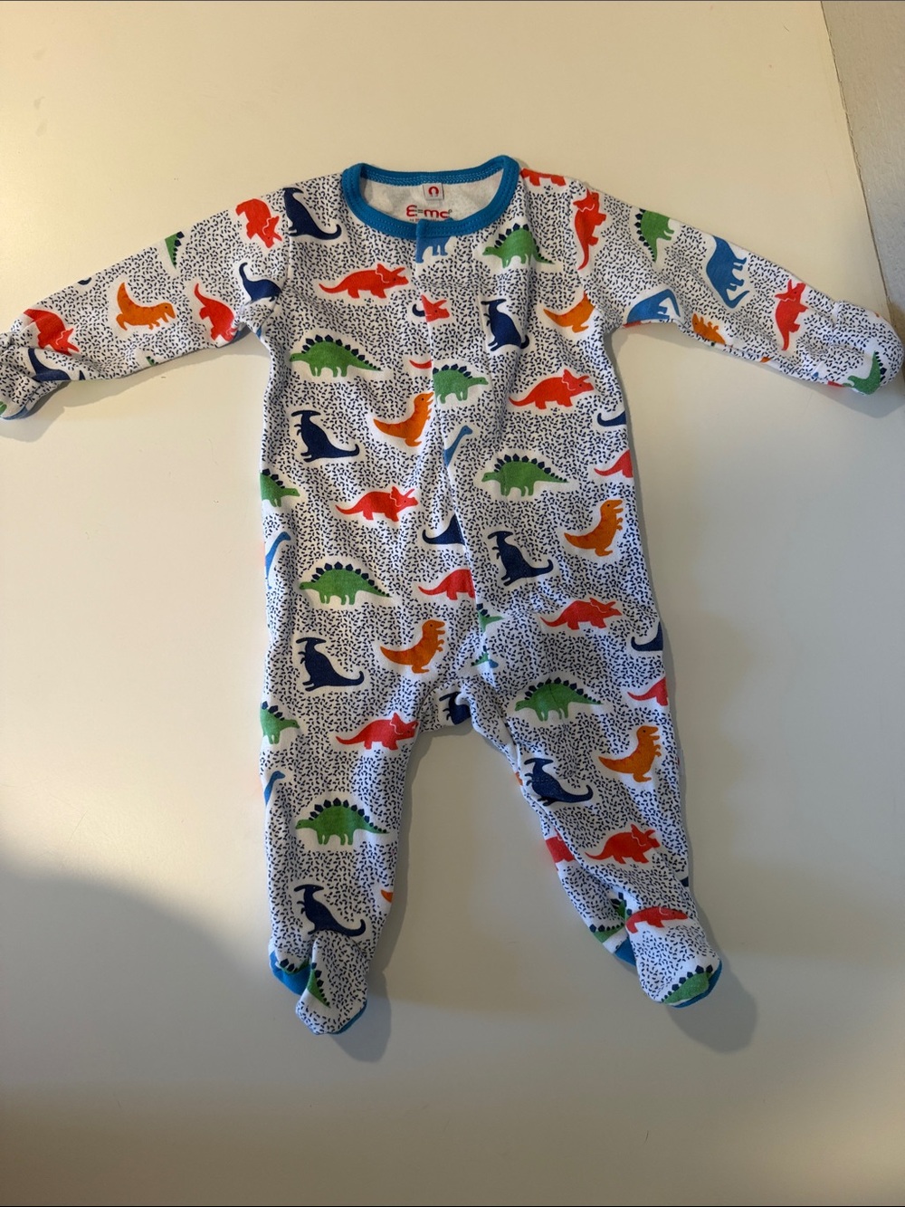 Magnetic me: White Multi Dinosaur Footed One-Piece with Blue Trim